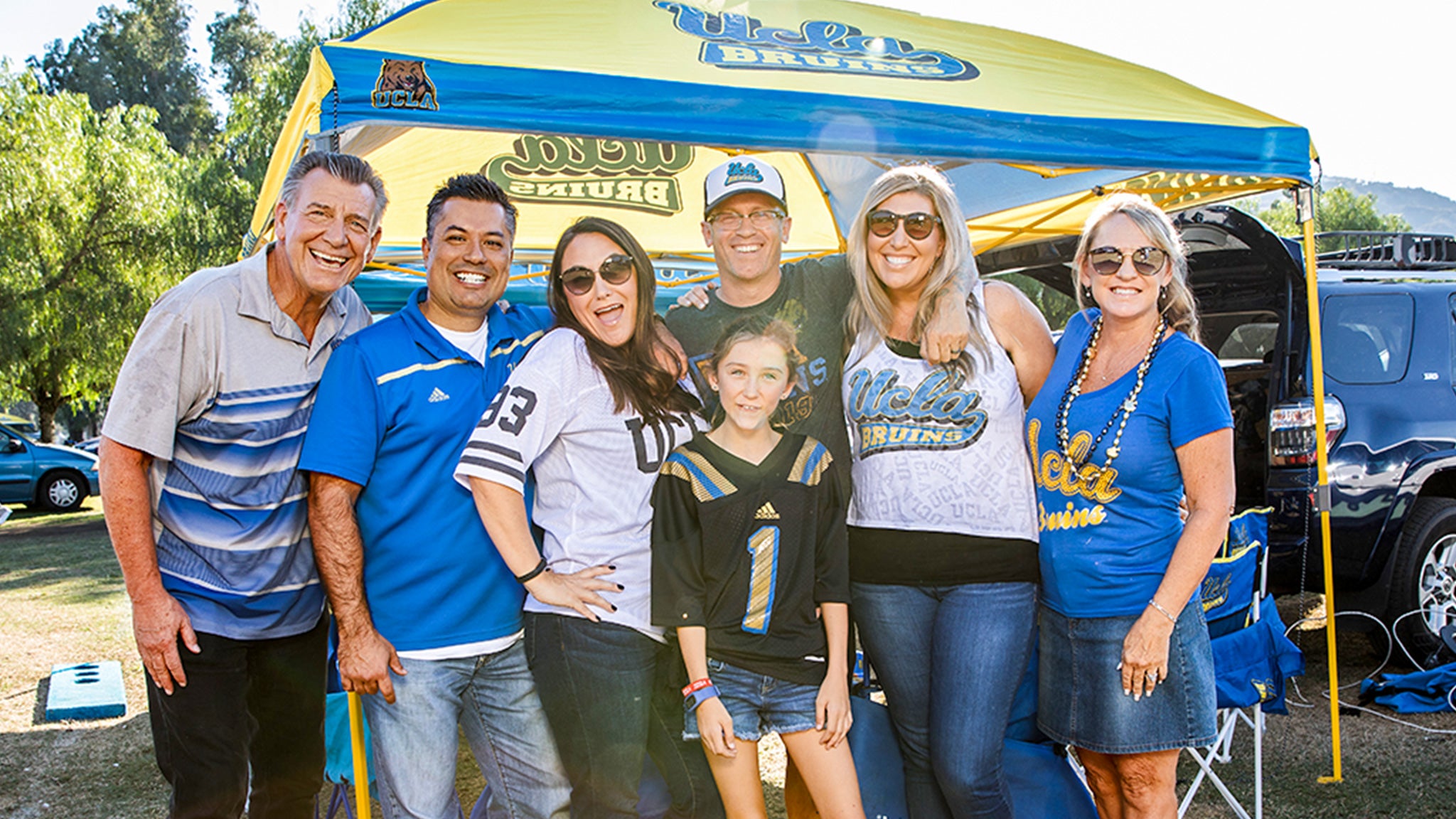 A family tailgates before seeing UCLA Football at the Rose Bowl during Bruin Family Weekend.