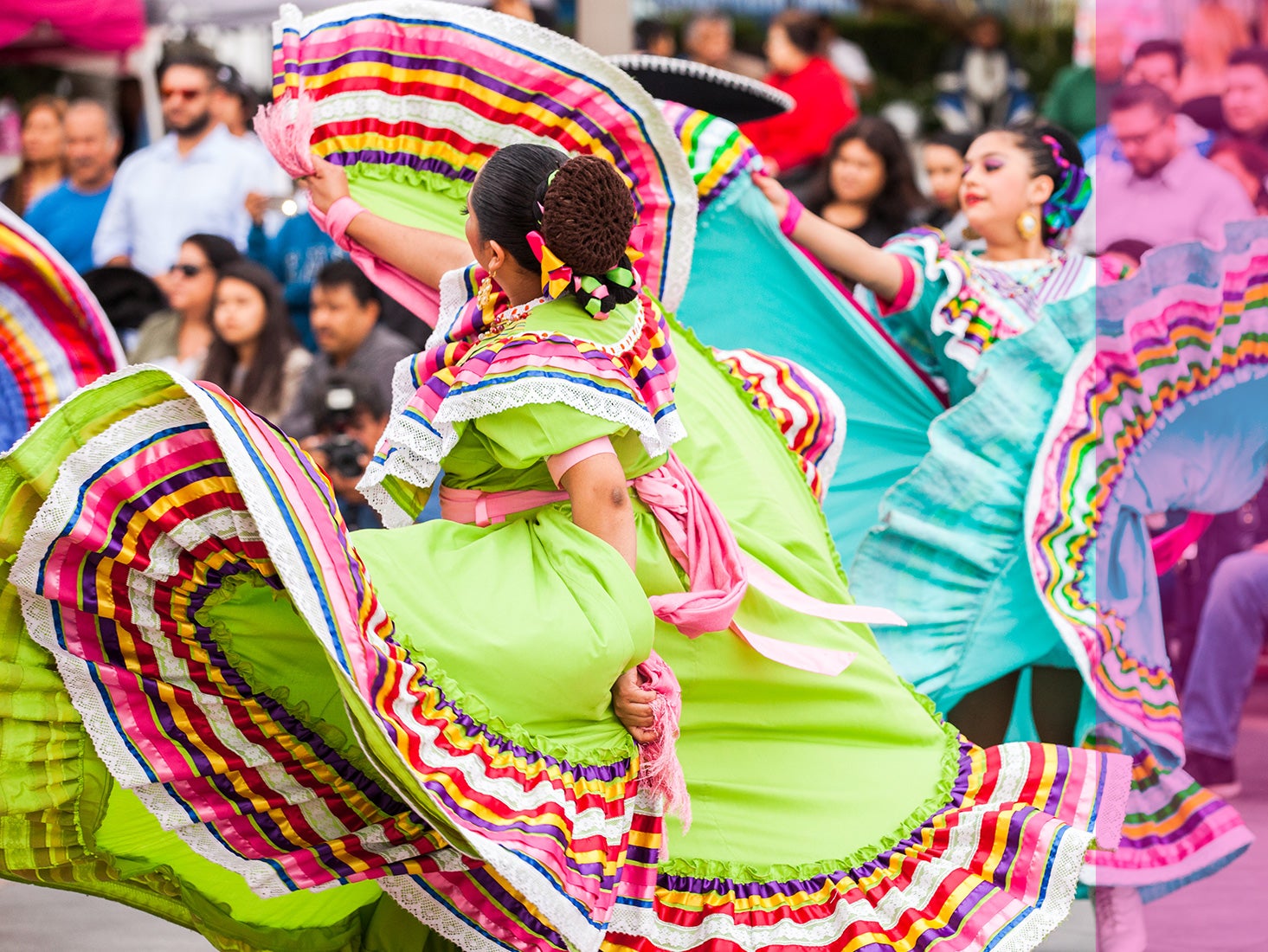 Colorfully dressed flamenco dancers perform before a crowd in downtown L.A.